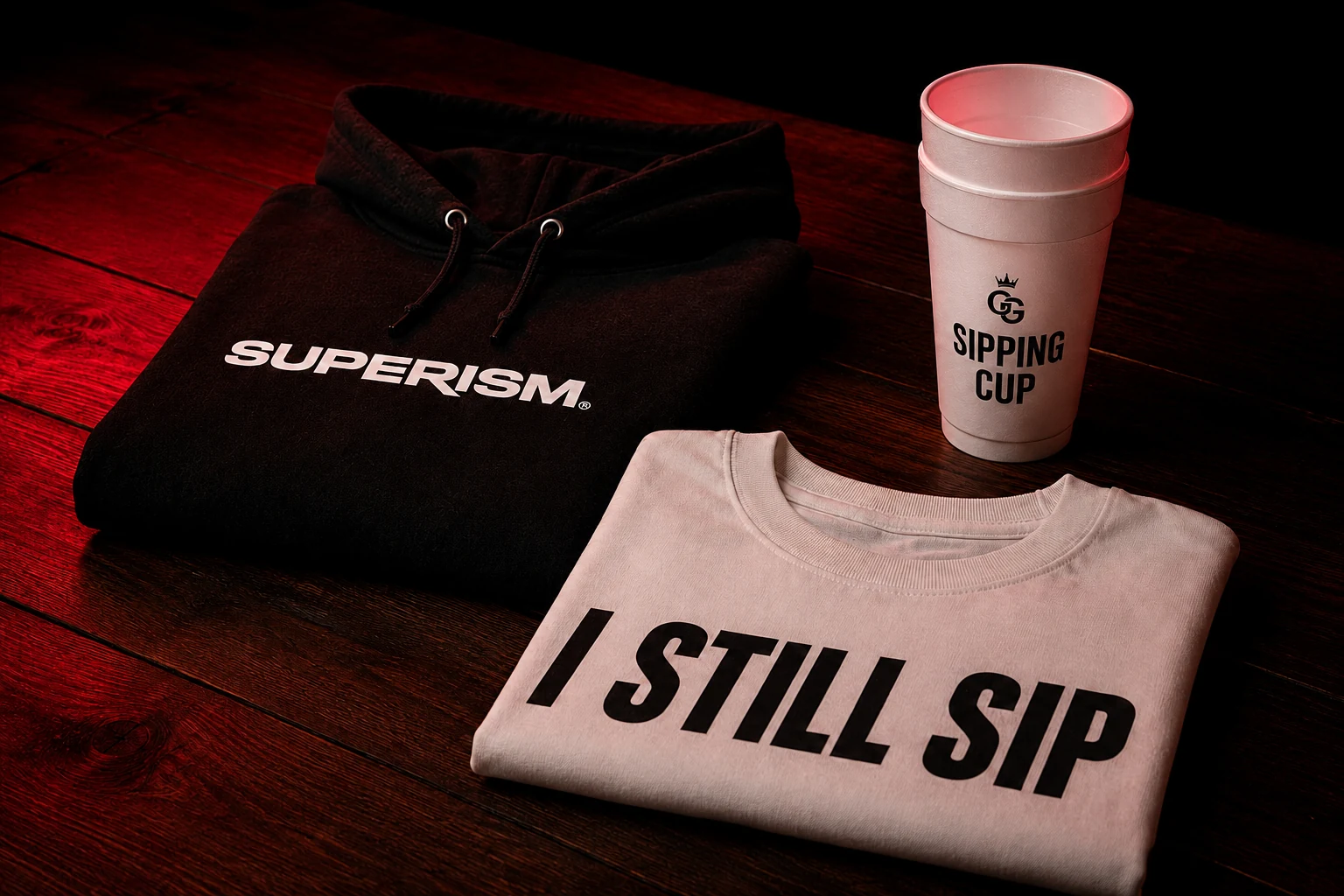 Grow Godz Superism apparel and Sipping Cup flat lay